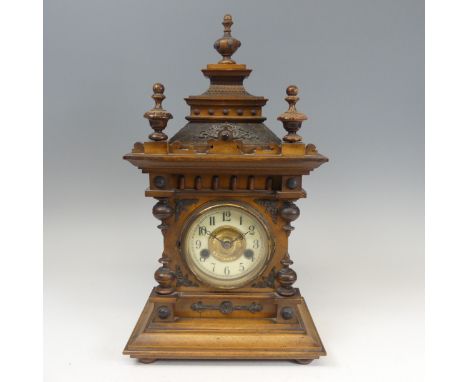 A late 19th century continental walnut Mantel Clock,&nbsp;movement marked with crossed arrows and label 'No. 3081', H 46 cm. 