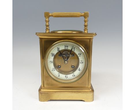 A large French brass carriage Clock, the dial&nbsp;centre inset with the visible lever escapement and enamel chapter ring wit