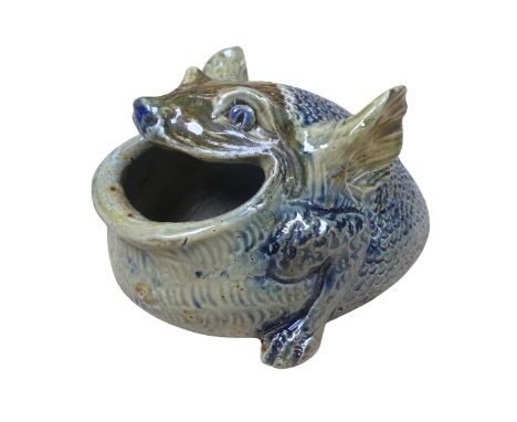A fine Martin Brothers stoneware Spoon Warmer, dated 1879, in the grotesque form, the scaly creature modelled agape for the i