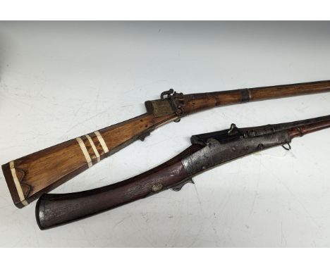 An Indian matchlock Toradar / Musket, with flared barrel, missing ramrod, L 175 cm, together with another heavy matchlock Mus