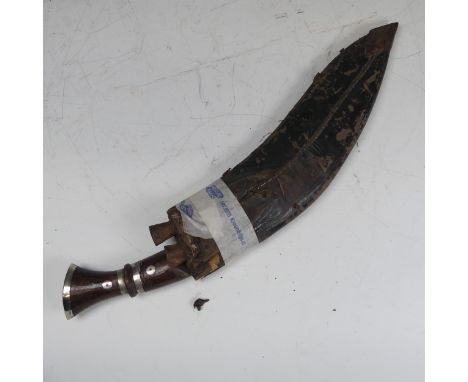 A 20th century Gurkha style Kukri Knife, 12 1/2 inch blade stamped 'GUARANTEED FSTSTEEL', complete with black leather scabbar