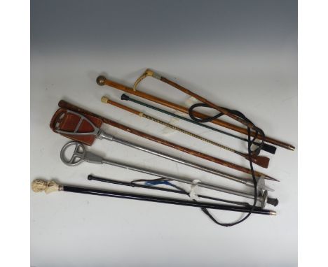 Vintage fishing gaff together with a quantity of various walking sticks