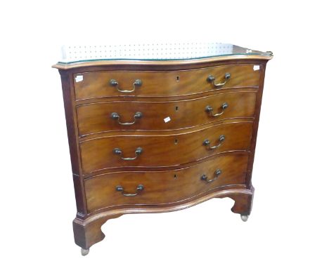 A George III style mahogany serpentine front Chest of drawers, raised on shaped bracket feet and castors, W 92 cm x H 86 cm x