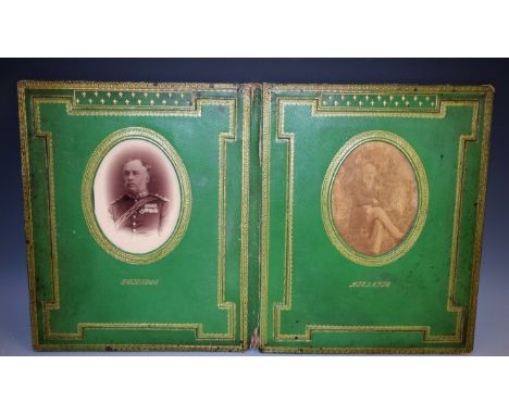 A late 19th century tooled and gilt green leather rectangular folio photograph frame, enclosing two oval apertures, one with 