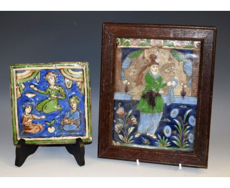 A Qajar type rectangular tile, decorated in the typical Persian taste with a figure and stylised flowers, 22cm x 16cm, oak fr
