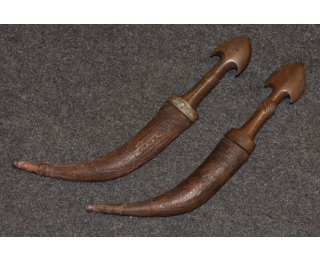 A 19th century North African Islamic jambaya, 24.5cm long typically curved steel blade, the hardwood grip with shaped arrowhe