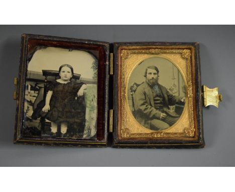 A Victorian ambrotype portrait,  of a seated gentleman, tooled and gilt leather case, 8cm x 6.5cm; another, of a young girl (