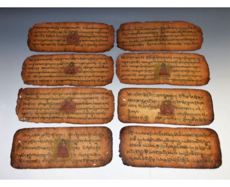 A collection of Tibetan manuscript pages, each painted with a figure in meditation and inscribed, 11cm x 28cm, 19th century o