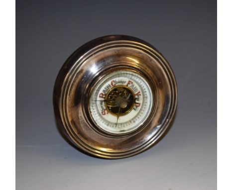 A George V silver circular aneroid desk barometer, 5cm ceramic register, 9.5cm diameter, Chester 1914