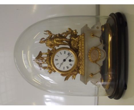 Late Victorian gilt spelter clock on alabaster plinth with glass dome