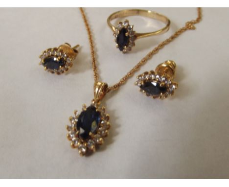 14 carat gold pendant, earring and ring set, with sapphires and white stones 