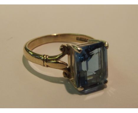 9 carat gold dress ring set with an emerald cut topaz, size O