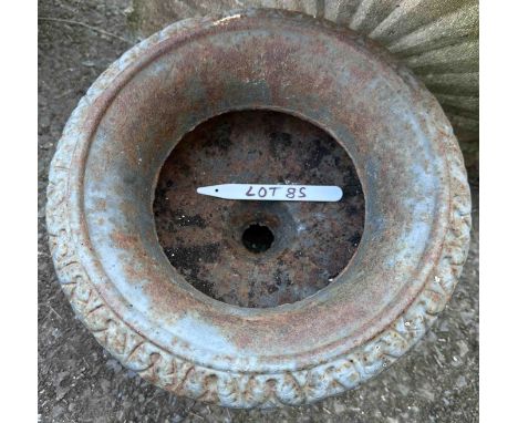A small cast iron planter of squat urn form - weathered
