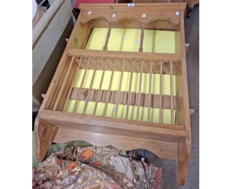 A 64cm vintage pine wall hanging plate rack with arcaded top and stick dividers