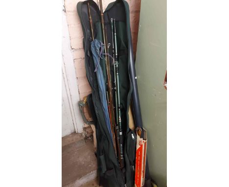 A selection of assorted fishing rods and related items including greenheart examples, also a Shakespeare reel