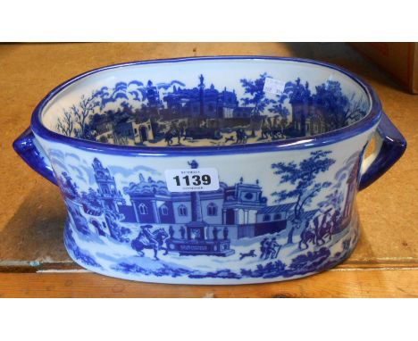 A small modern ceramic footbath with blue transfer printed decoration