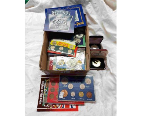 A box containing a collection of pre-decimal and later mainly commemorative sets of GB and foreign coinage including encapsul