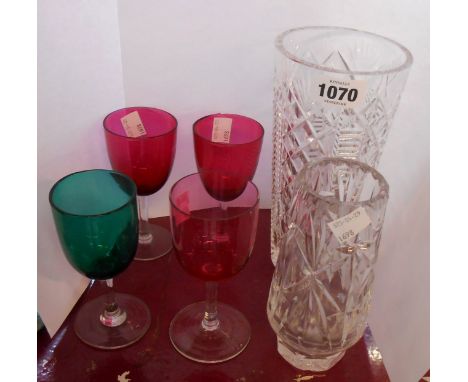A small quantity of glassware comprising Waterford crystal cut glass vase, another cut glass vase, three cranberry bowl glass