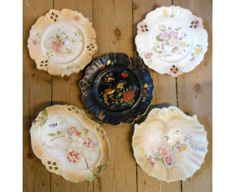 Two 19th Century Carltonware plates each with pierced decoration and hand painted floral designs on an ivory and blush ground