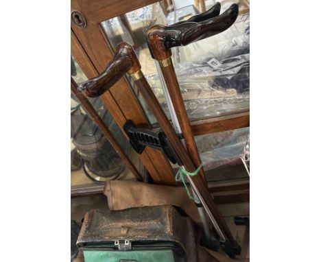 Three modern walking sticks and a grab stick
