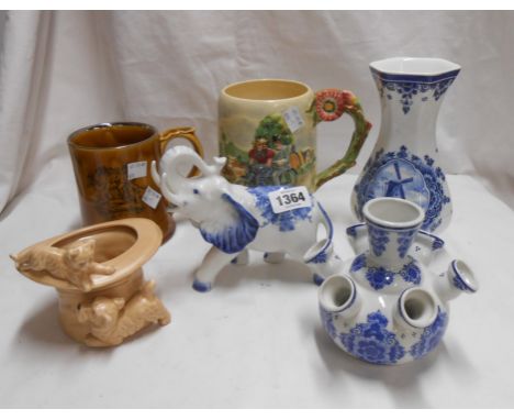 A quantity of ceramics including Crown Devon 'Daisy' musical mug (a/f), Dutch Delft vases and elephant figurine, etc.