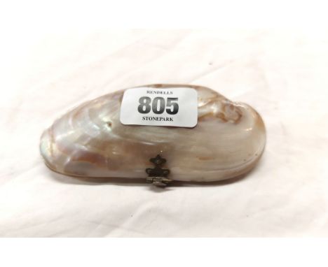 An antique hinged mother-of-pearl trinket purse fitted internally with blue leather compartments