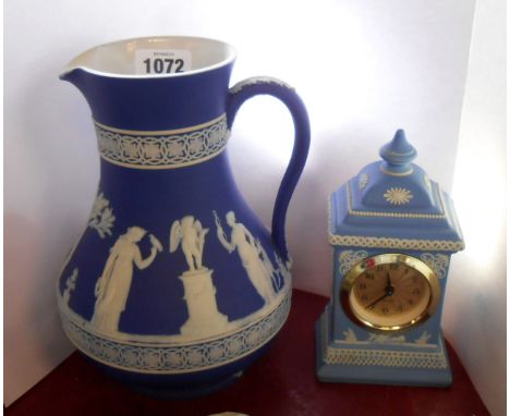 A 19th Century Wedgwood dark blue Jasper dip jug (chip to foot rim) with typical classical frieze decoration - sold with a si
