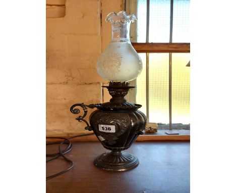 A Victorian silver plated oil lamp of urn form with glass chimney - one handle detached but included