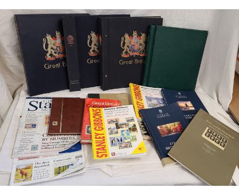 A box containing a quantity of empty stamp albums and stock books, also various philatelic publications and catalogues