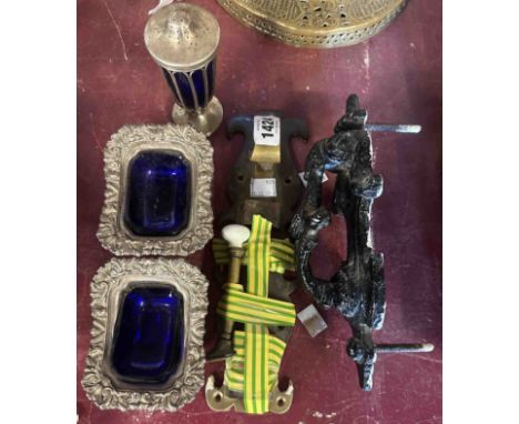 A small quantity of metalware comprising a Victorian cast iron door knocker, old brass door bolt, brass coat hook with cerami