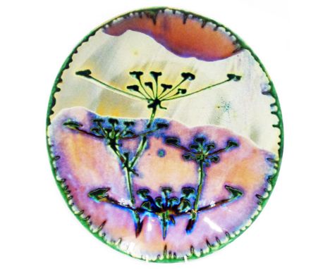 A large Dartington Studio pottery oval charger decorated in the 'Fennel' pattern with green drip border and a mottled lilac g