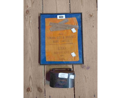 A picture frame containing London City - Midland Bank money bag for £300 Sovereigns - sold with a National Provincial metal m