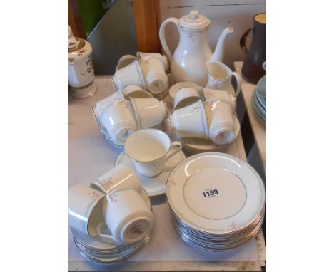 A quantity of Royal Doulton bone china teaware decorated in the 'Carnation' pattern comprising coffee pot, milk jug, sugar bo