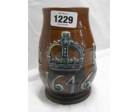 A late 19th Century Edward Binham Castle Hedingham art pottery mug, made as a reproduction of Charles II Coronation tankard w