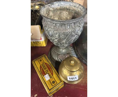 A 1924 Wembley Exhibition brass 'Lipton's Tea' caddy, a pewter oil lamp base with white metal dedication plaque and a Will's 