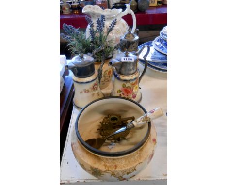 Three 19th Century Carltonware claret jugs with floral decoration on a blush ground and plated fittings - sold with a similar