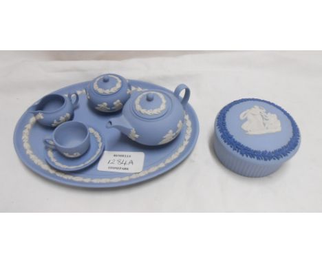 A Wedgwood blue Jasper miniature tea set for one comprising teapot, sucrier, cup and saucer, milk jug and tray - sold with a 