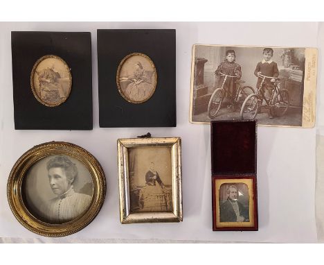 A small collection of antique photographs comprising leather folding cased daguerreotype portrait of a gentleman, framed port