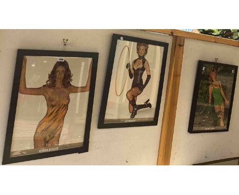 Three ebonised framed 1973 Pirelli calendar pin-up girl prints, comprising July, October and December