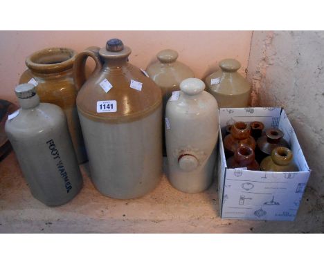 Five stoneware hot water bottles - sold with a stoneware flagon, a similar storage jar and a box containing three stoneware b