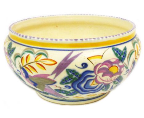 An Art Deco Carter, Stabler and Adams Poole Pottery bowl with hand painted decoration, depicting a stylised bird amidst flowe