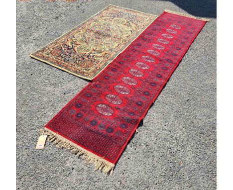 A vintage Wilton machine made Persian pattern rug - sold with a machine made Turkoman runner with red ground - the larger 2.7