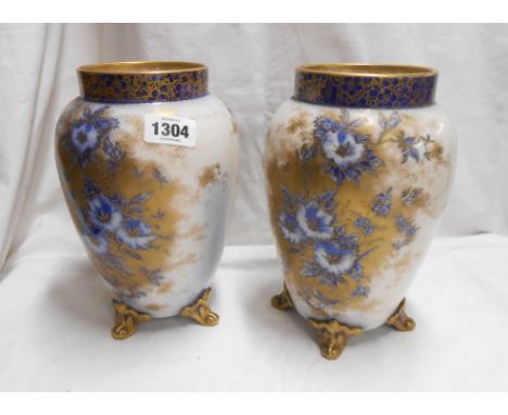 A pair of late 19th Century Carltonware vases decorated in the 'Petunia' pattern with flow blue and gilt floral decoration, e