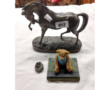 A resin horse, a Teddy bear and book ornament and a small metal trinket box