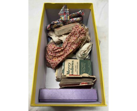 A box containing vintage games including a bag of marbles, a set of celluloid poker dice, doll's clothes, a seal of Jane Seym