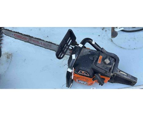 A petrol Oleo Mac chainsaw