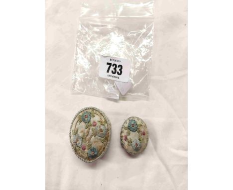 An early 20th Century embroidered silk miniature powder pot and a similar tape measure