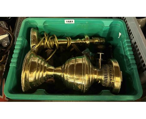 A crate containing a quantity of metalware including brass oil lamp, brass table lamp of candlestick form, cast iron bootjack