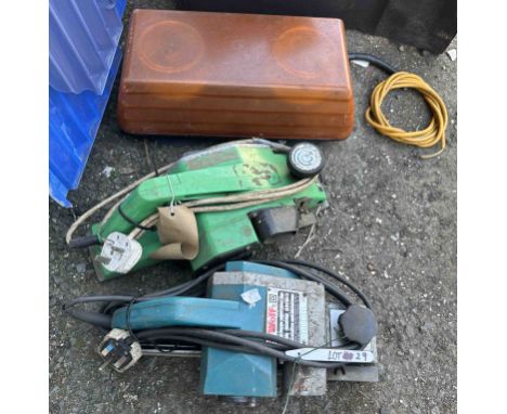 A Xenon beam light - sold with two electric planers, one by Wolf, the other Hitachi
