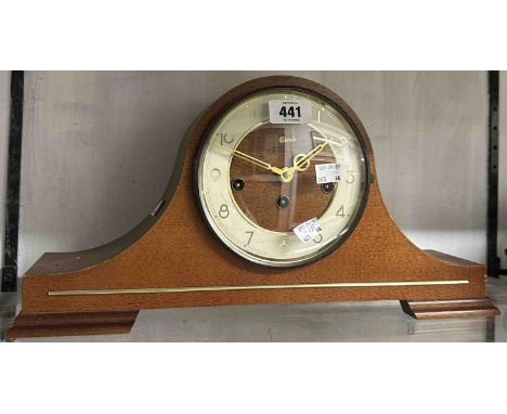 A vintage Hermle polished wood cased Napoleon hat mantel clock with floating balance eight day chiming movement